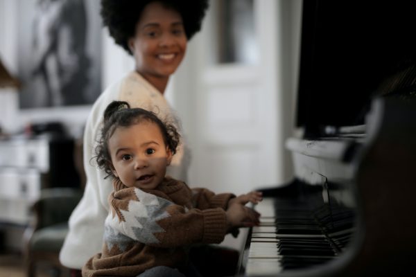 baby play piano with the teacher